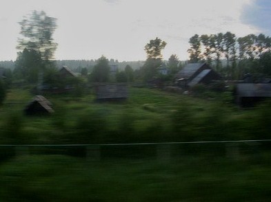 Wooden houses crouching by the train line...